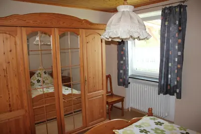 Ein Bett oder Betten in einem Zimmer der Unterkunft Ferienhof Pöhlmann