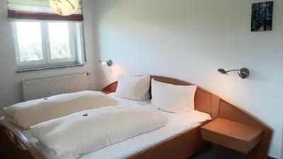 Ein Bett oder Betten in einem Zimmer der Unterkunft Ferienhof Lang