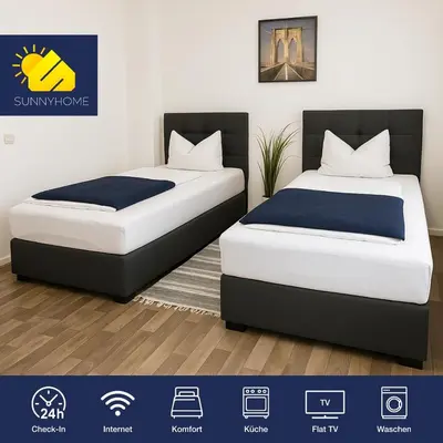 Ein Bett oder Betten in einem Zimmer der Unterkunft SUNNYHOME Monteurwohnungen und Apartments in Weiden