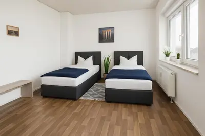 Ein Bett oder Betten in einem Zimmer der Unterkunft SUNNYHOME Monteurwohnungen und Apartments in Weiden
