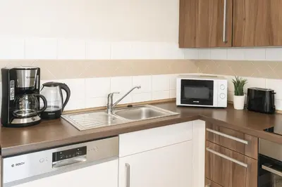 Küche/Küchenzeile in der Unterkunft SUNNYHOME Ferienwohnung am Brückelsee