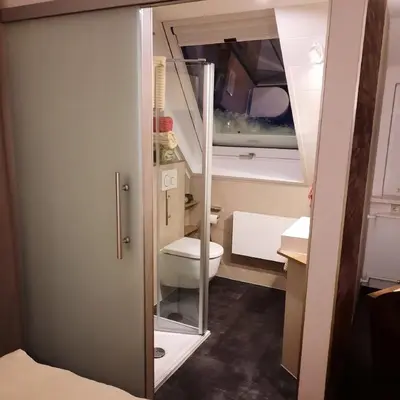 Ein Bett oder Betten in einem Zimmer der Unterkunft Waldgasthof Lorchenmühle UG