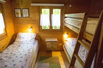 Ein Bett oder Betten in einem Zimmer der Unterkunft Ferienhaus Bayern Chalet 22