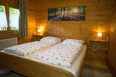 Ein Bett oder Betten in einem Zimmer der Unterkunft Ferienhaus Bayern Chalet 22