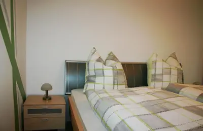 Ein Bett oder Betten in einem Zimmer der Unterkunft Ferienwohnung Maria