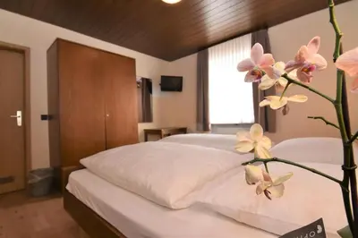 Ein Bett oder Betten in einem Zimmer der Unterkunft Landgasthof Grüner Baum