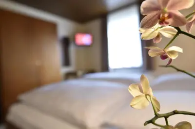 Ein Bett oder Betten in einem Zimmer der Unterkunft Landgasthof Grüner Baum