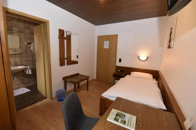 Ein Bett oder Betten in einem Zimmer der Unterkunft Landgasthof Grüner Baum