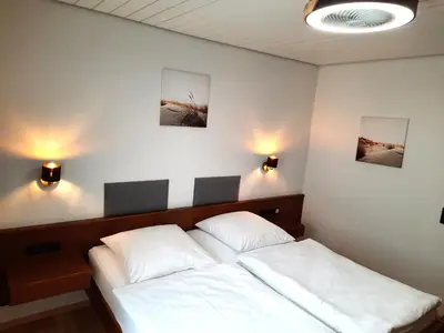 Ein Bett oder Betten in einem Zimmer der Unterkunft Landgasthof Grüner Baum