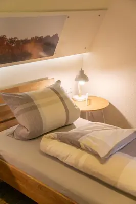 Ein Bett oder Betten in einem Zimmer der Unterkunft Eckerts Quartier