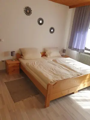 Ein Bett oder Betten in einem Zimmer der Unterkunft Gasthof Pension Weißes Rössl