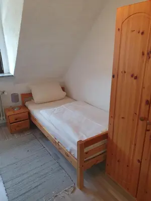Ein Bett oder Betten in einem Zimmer der Unterkunft Gasthof Pension Weißes Rössl