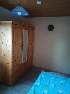 Ein Bett oder Betten in einem Zimmer der Unterkunft Ferienwohnung Preuß