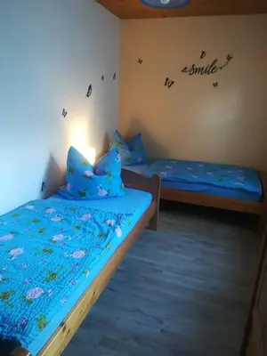Ein Bett oder Betten in einem Zimmer der Unterkunft Ferienwohnung Preuß