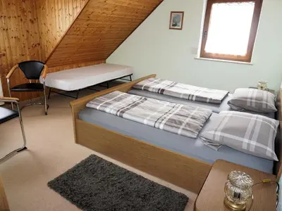 Ein Bett oder Betten in einem Zimmer der Unterkunft Haus Burgblick