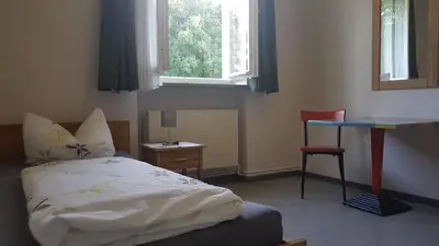 Ein Bett oder Betten in einem Zimmer der Unterkunft Gästehaus Sandra