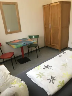 Ein Bett oder Betten in einem Zimmer der Unterkunft Gästehaus Sandra