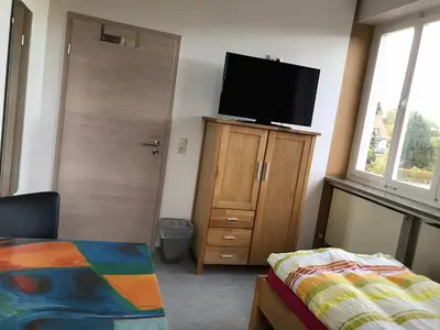 Ein Bett oder Betten in einem Zimmer der Unterkunft Gästehaus Sandra
