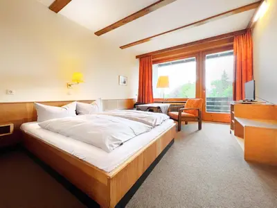 Ein Bett oder Betten in einem Zimmer der Unterkunft WAGNERS Hotel im Fichtelgebirge