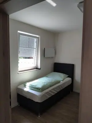 Ein Bett oder Betten in einem Zimmer der Unterkunft Haus Brückelsee
