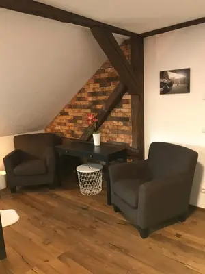 Ein Sitzbereich in der Unterkunft Wieko Ferienwohnungen - Luxus Pur im Prinz von Preußen