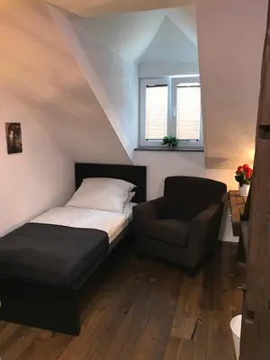 Ein Bett oder Betten in einem Zimmer der Unterkunft Wieko Ferienwohnungen - Luxus Pur im Prinz von Preußen