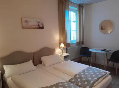 Ein Bett oder Betten in einem Zimmer der Unterkunft Hotel-Gasthof Opel Bed & Breakfast