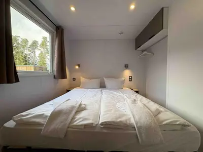 Ein Bett oder Betten in einem Zimmer der Unterkunft WA100 - Moderne Mobilheime im Oberpfälzer Seenland