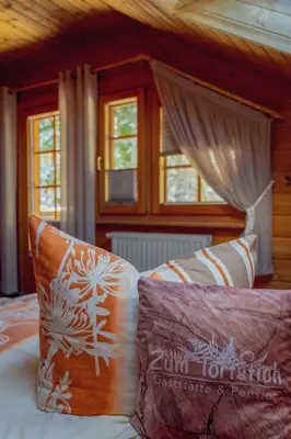 Ein Bett oder Betten in einem Zimmer der Unterkunft Gaststätte und Pension Zum Torfstich
