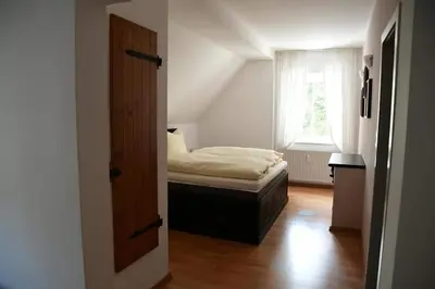Ein Bett oder Betten in einem Zimmer der Unterkunft Hotel Berggasthof Waldlust