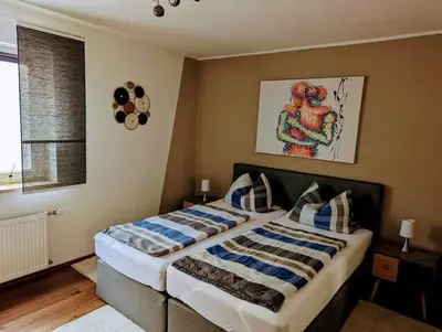 Ein Bett oder Betten in einem Zimmer der Unterkunft Ferienwohnung Jobst - Ruhig mit Blick ins Grüne