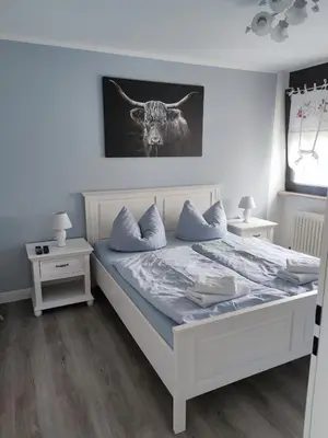 Ein Bett oder Betten in einem Zimmer der Unterkunft FEWO