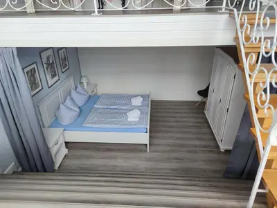 Ein Bett oder Betten in einem Zimmer der Unterkunft FEWO