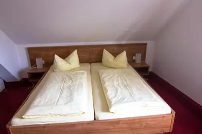 Ein Bett oder Betten in einem Zimmer der Unterkunft Ratsstube Pegnitz
