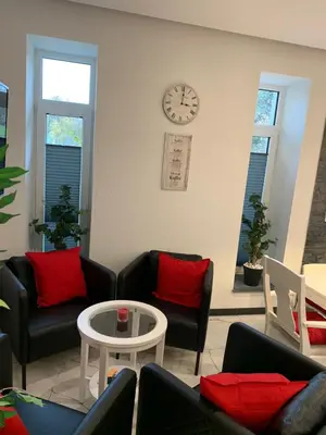 Ein Sitzbereich in der Unterkunft Wieko Ferienwohnungen - Luxus pur im Prinz von Preußen, Erdgeschoss