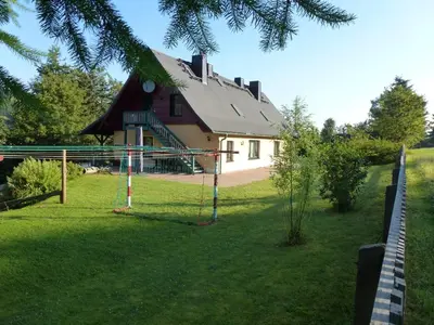 Ein Garten an der Unterkunft Ferienwohnungen Weißflog