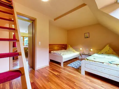 Ein Bett oder Betten in einem Zimmer der Unterkunft Ferienwohnungen Weißflog