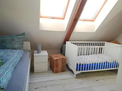 Ein Bett oder Betten in einem Zimmer der Unterkunft Ferienwohnung Baumann