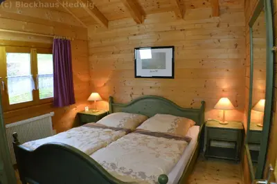 Ein Bett oder Betten in einem Zimmer der Unterkunft Blockhaus Hedwig Haus 10