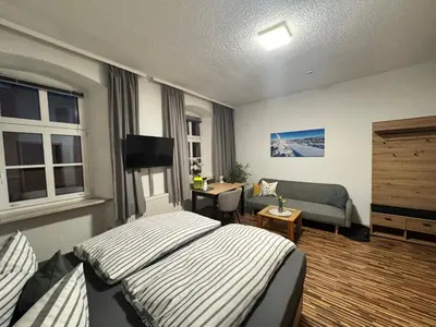 Ein Bett oder Betten in einem Zimmer der Unterkunft Gasthof Hotel Bräustübl und Haus Boutique