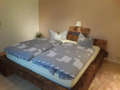 Ein Bett oder Betten in einem Zimmer der Unterkunft Ferienwohnung Döhlerwald