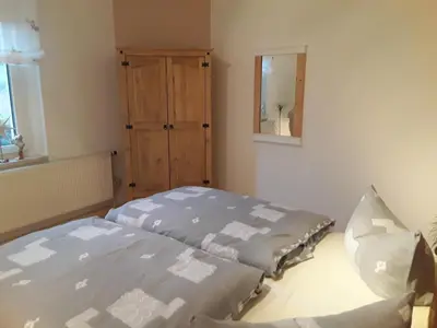 Ein Bett oder Betten in einem Zimmer der Unterkunft Ferienwohnung Döhlerwald