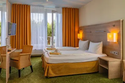 Ein Bett oder Betten in einem Zimmer der Unterkunft Der Bayerische Hof