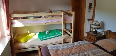 Ein Bett oder Betten in einem Zimmer der Unterkunft Ferienhaus Gemütlichkeit