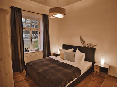 Ein Bett oder Betten in einem Zimmer der Unterkunft Feriendomizil Villa Neidstein