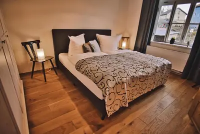 Ein Bett oder Betten in einem Zimmer der Unterkunft Feriendomizil Villa Neidstein