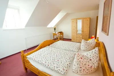 Ein Bett oder Betten in einem Zimmer der Unterkunft Hotel Garni Am Klostermarkt