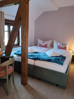 Ein Bett oder Betten in einem Zimmer der Unterkunft Auersberg Haus