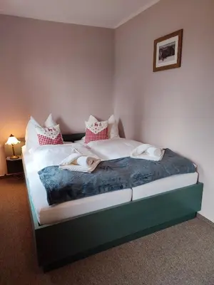 Ein Bett oder Betten in einem Zimmer der Unterkunft Auersberg Haus