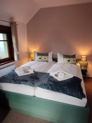 Ein Bett oder Betten in einem Zimmer der Unterkunft Auersberg Haus